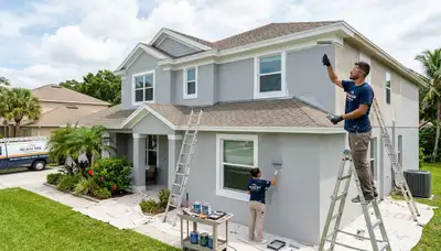 Professional house painters working on exterior home in Fort Lauderdale FL