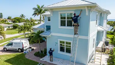 Professional house painters working on home exterior in Fort Lauderdale FL