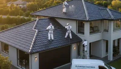 Professional roof painters coating a home in Fort Lauderdale FL for sun and storm protection